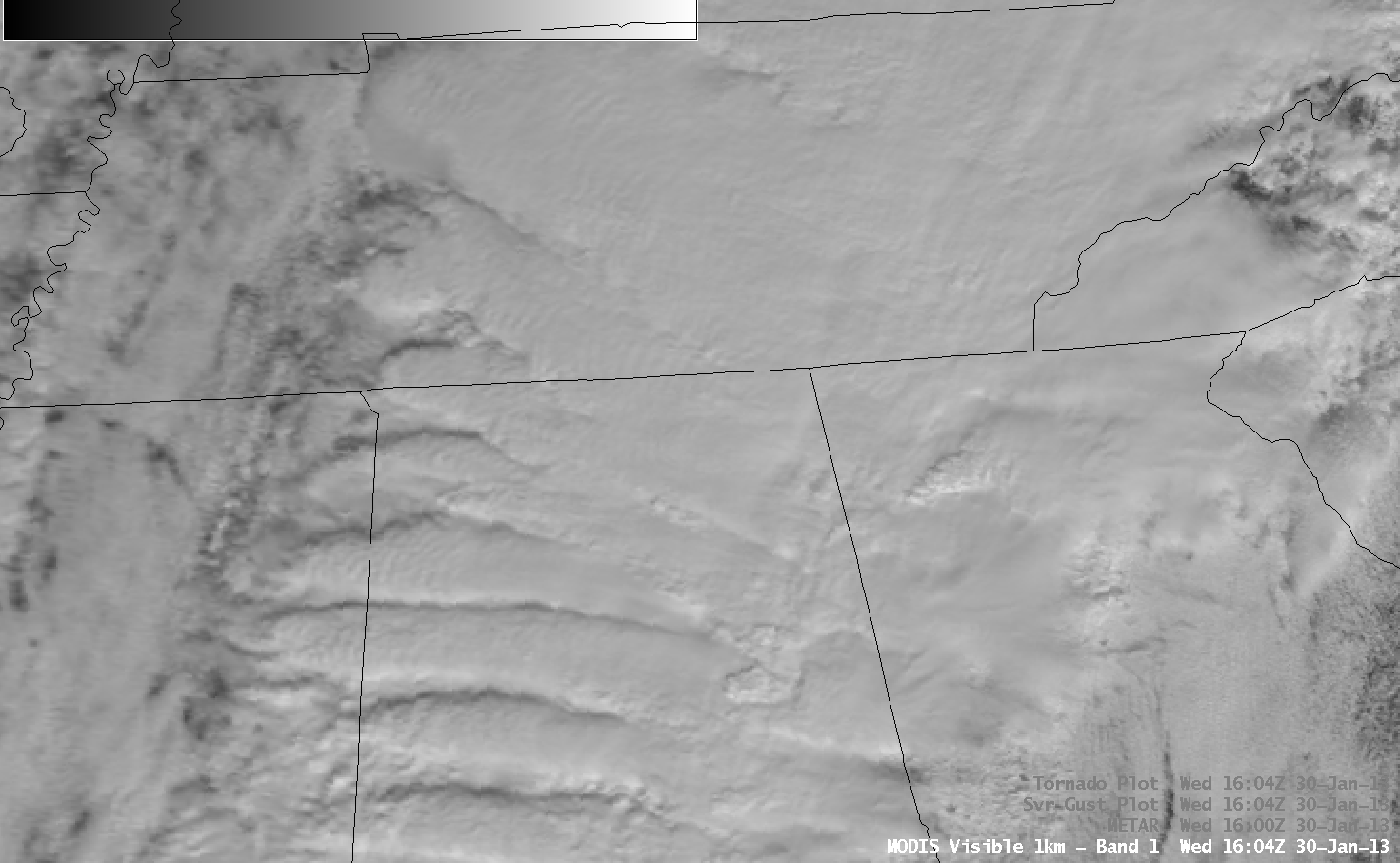MODIS 0.65 Âµm visible channel and 11.0 Âµm IR channel images, with METAR surface reports and SPC storm reports