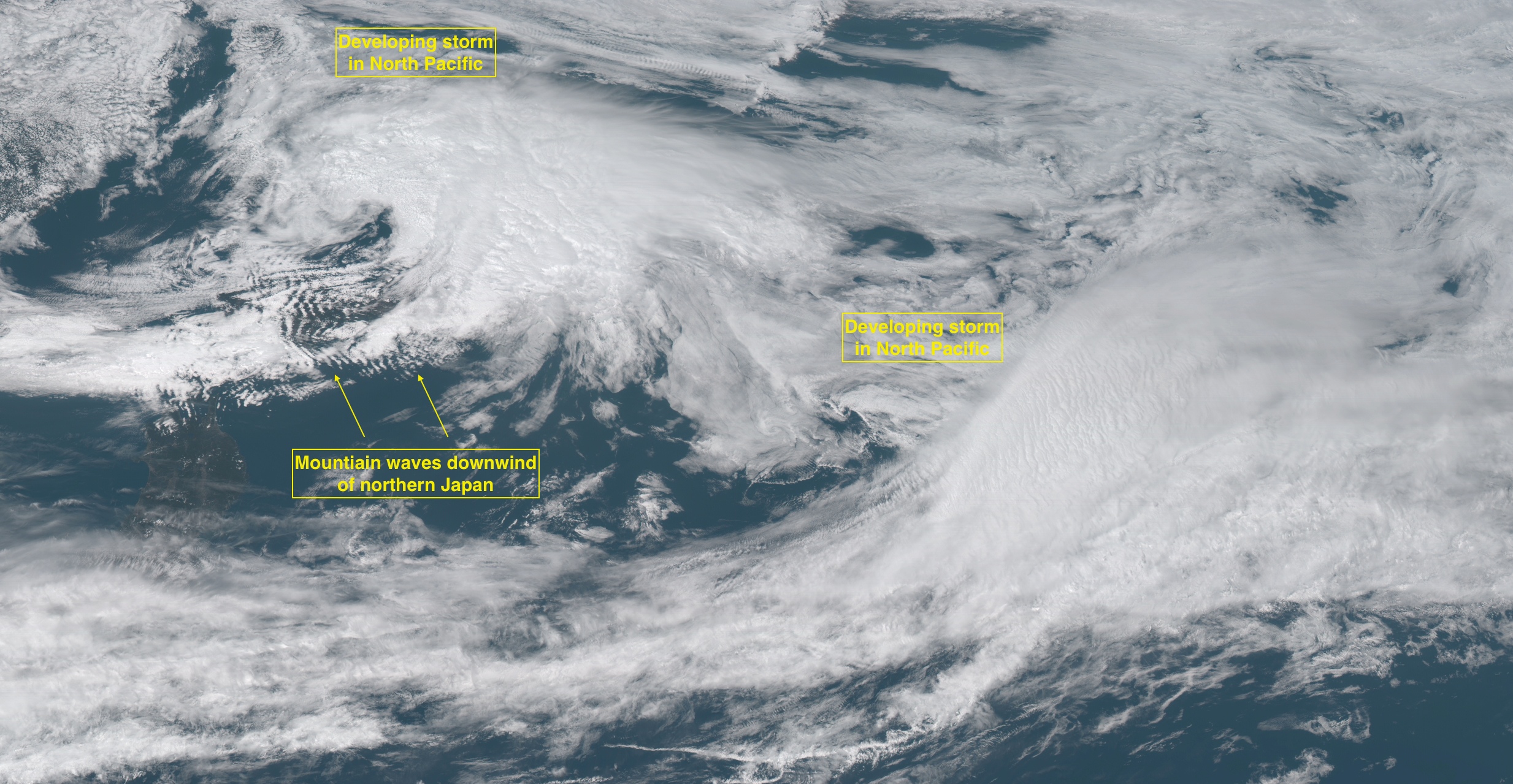 Mountain waves downwind of Japan, and developing storms in the North Pacific Ocean