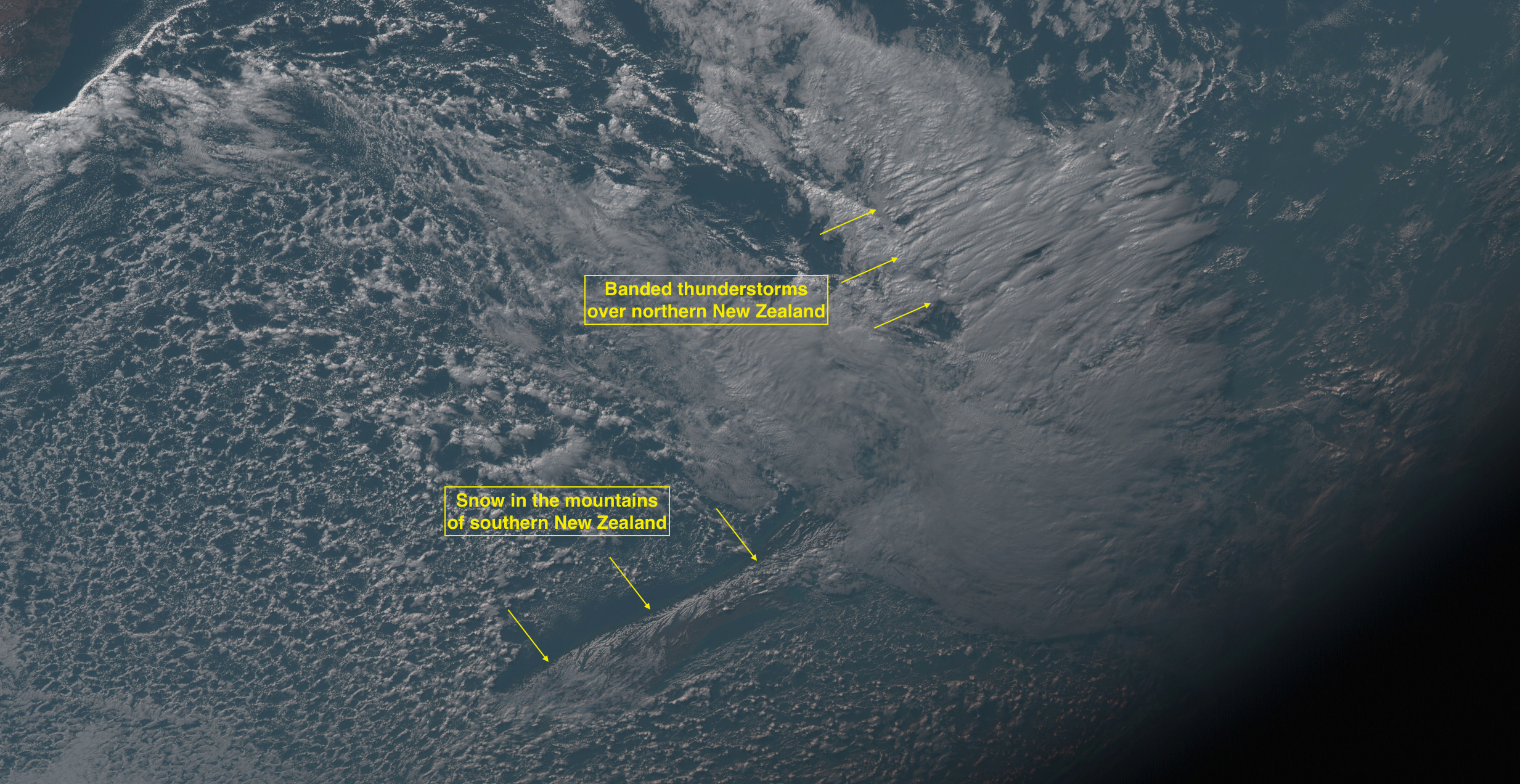 Banded thunderstorms over northern New Zealand, and snow cover in the mountains of southern New Zealand